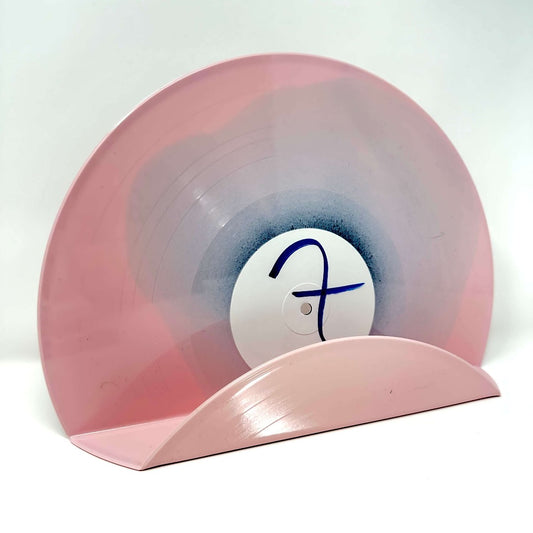 A cool pink vinyl record used as a decor display