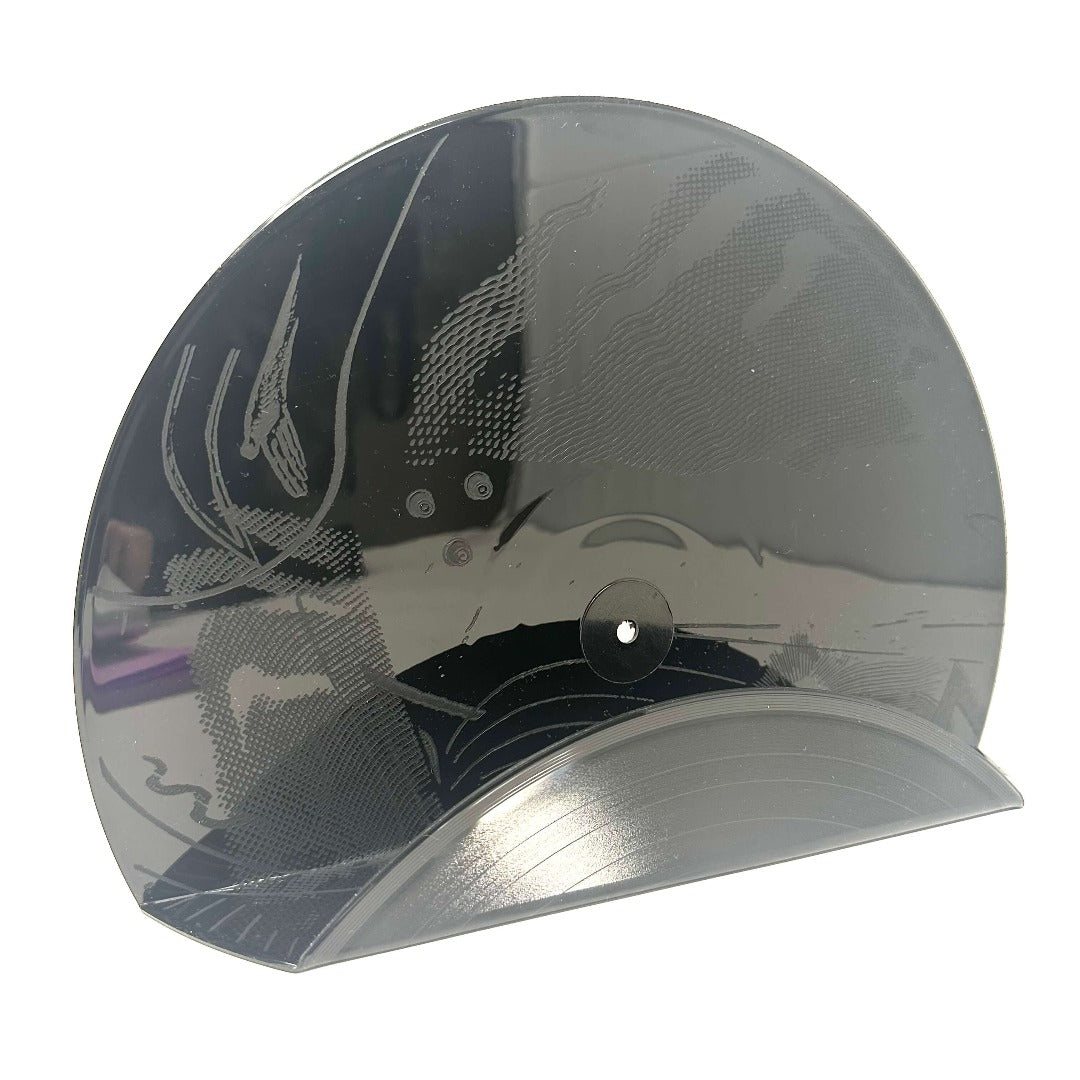 A funky black hetched vintage vinyl record used as a decor shelf