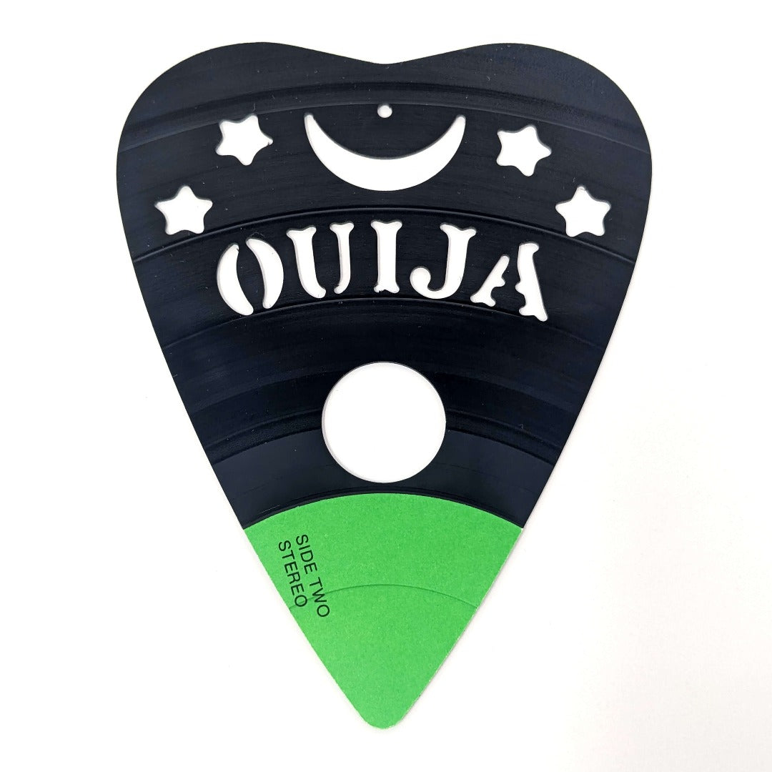 Handcrafted table from reclaimed vinyl records with Ouija CNC art.