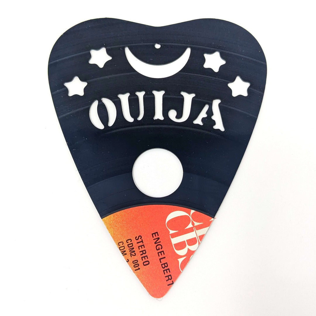 Ouija board design on repurposed vinyl record table.