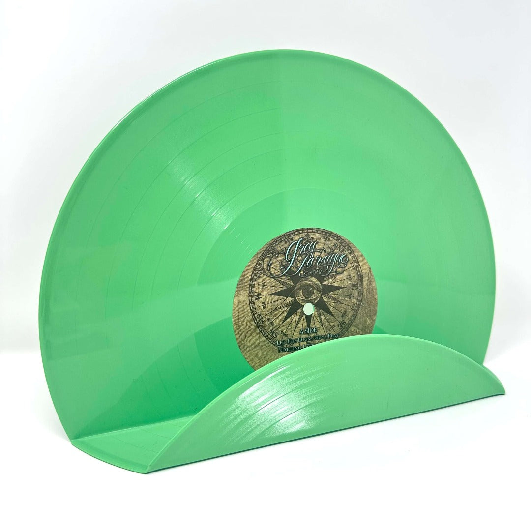 An artistic green vinyl record used as a decor display