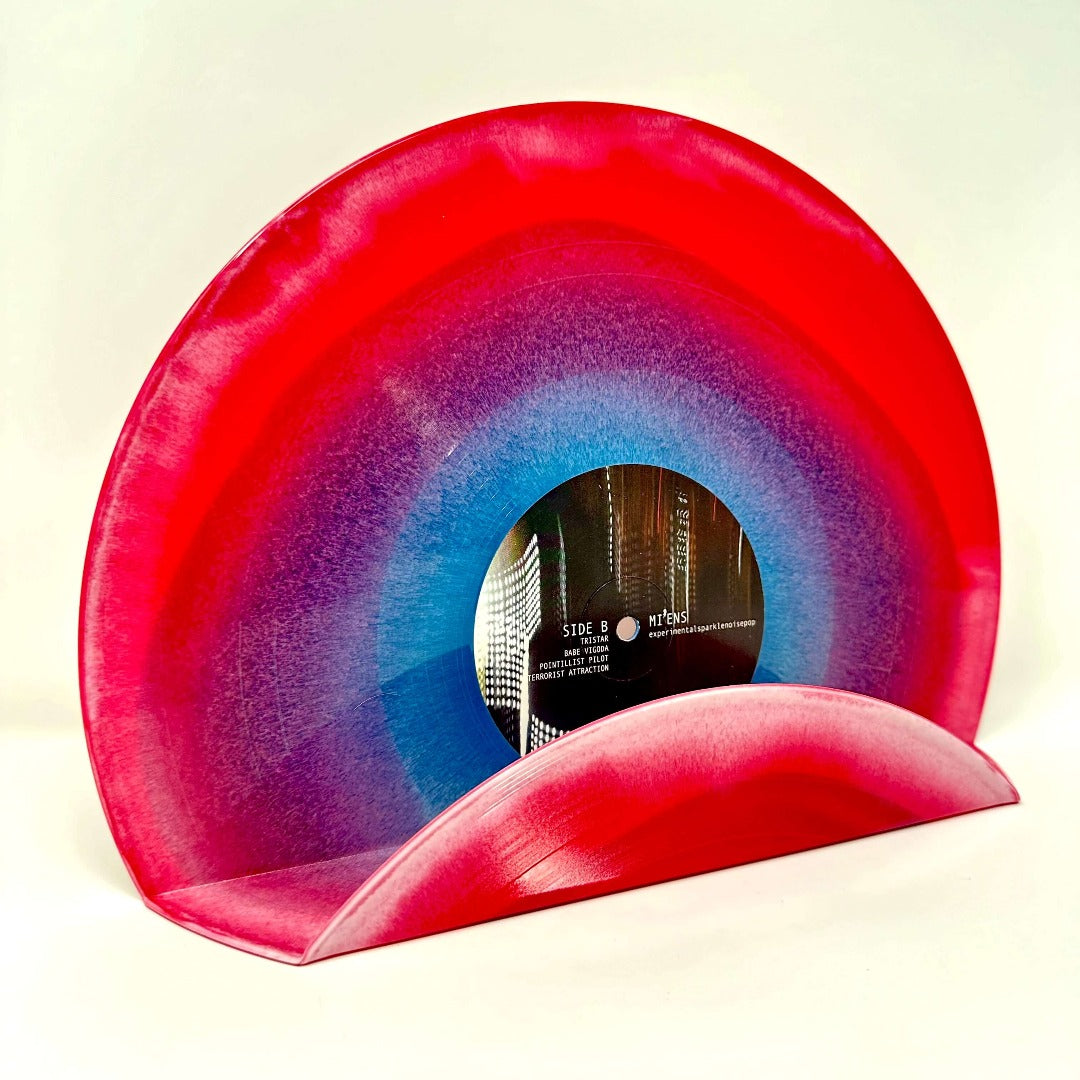 A chic swirl red and blue vinyl record used as a decor display