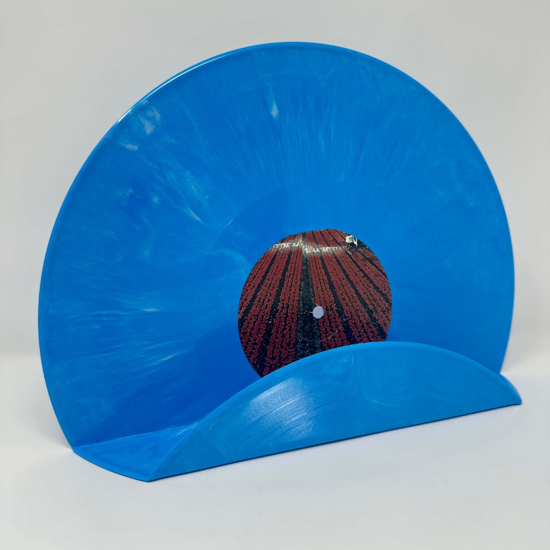 A creative blue vintage vinyl record used as a decor shelf