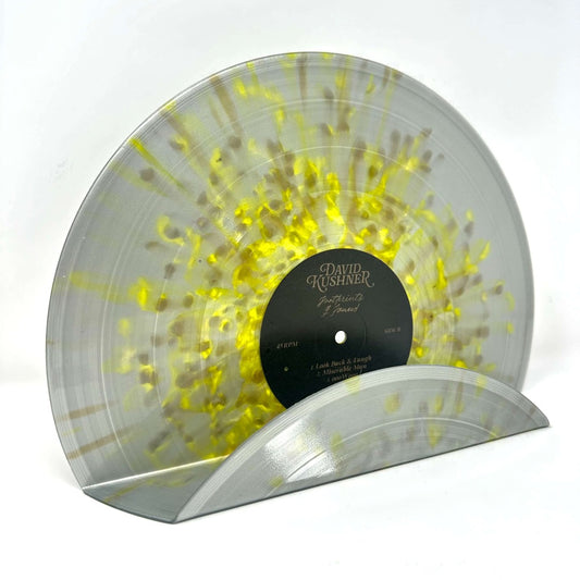 An eco-friendly splatter gold grey vintage vinyl record used as a decor shelf