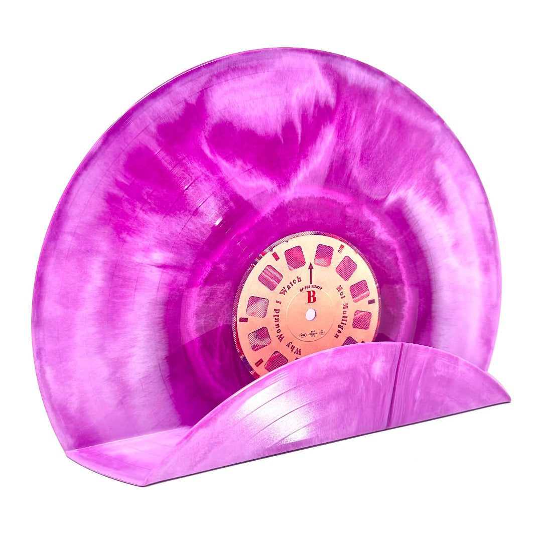 A retro-style pink swirl vinyl record used as a wall decor shelf