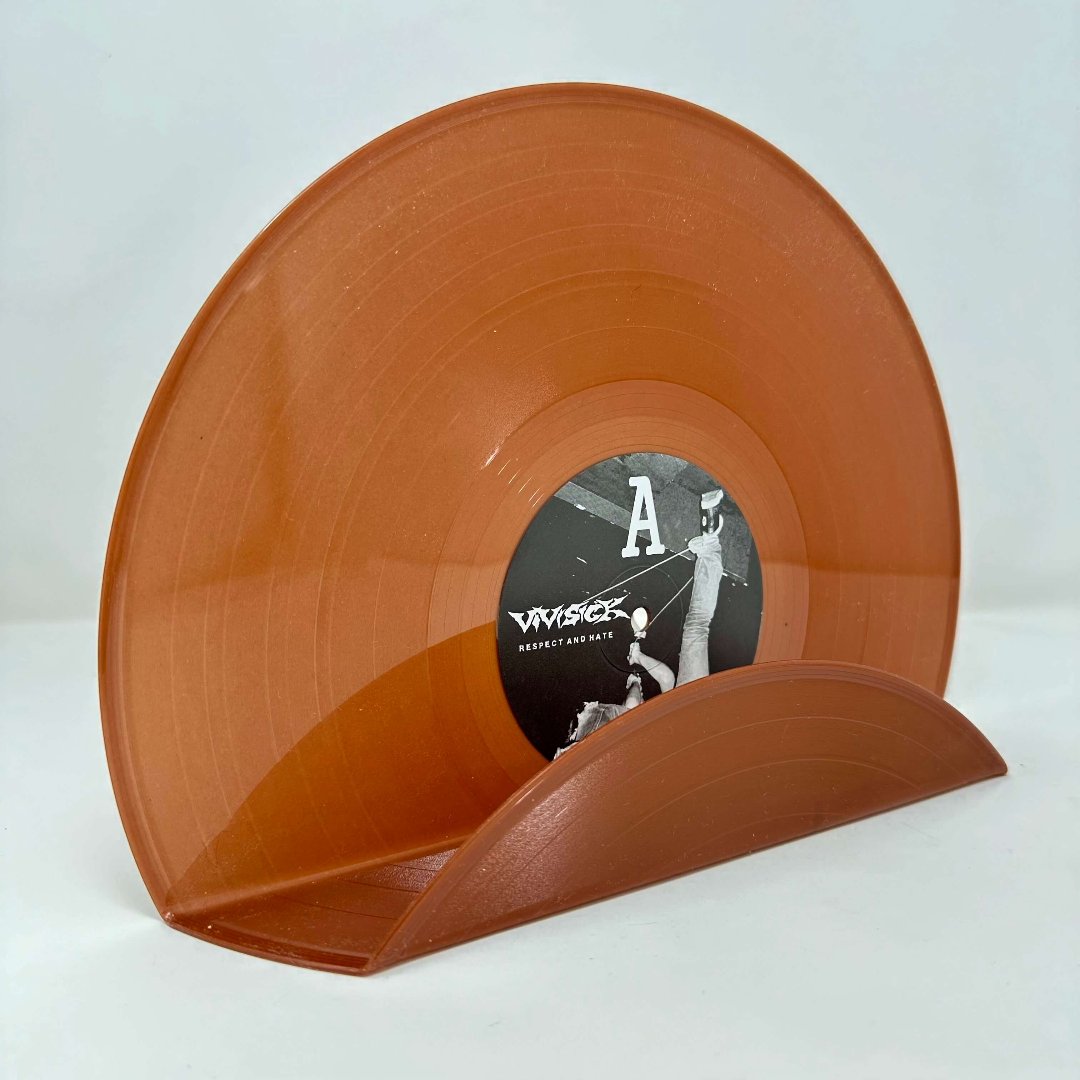 A retro-style brown vinyl record used as a wall decor shelf