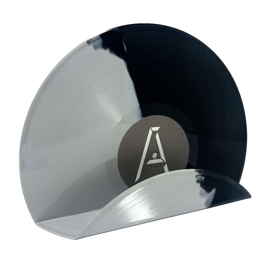 A trendy grey and black vintage vinyl record used as a wall decor shelf
